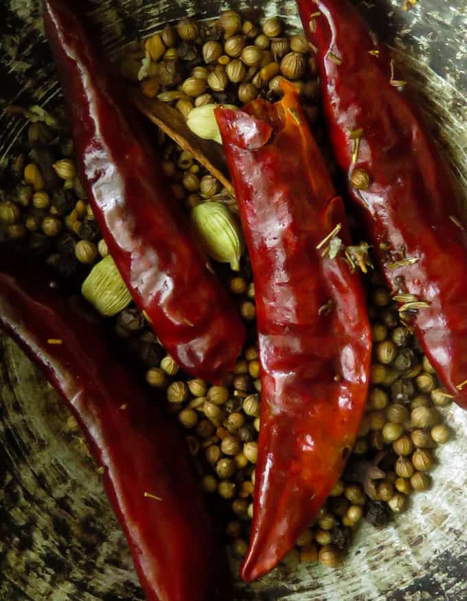 dry roasting the spices including dry red chillies to make the vindaloo powder.