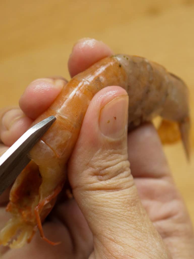 cuttin the shell to devein the shrimp