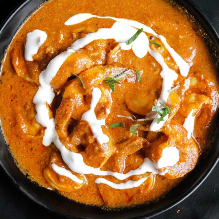 shrimp tikka masala served a drizzle of cream