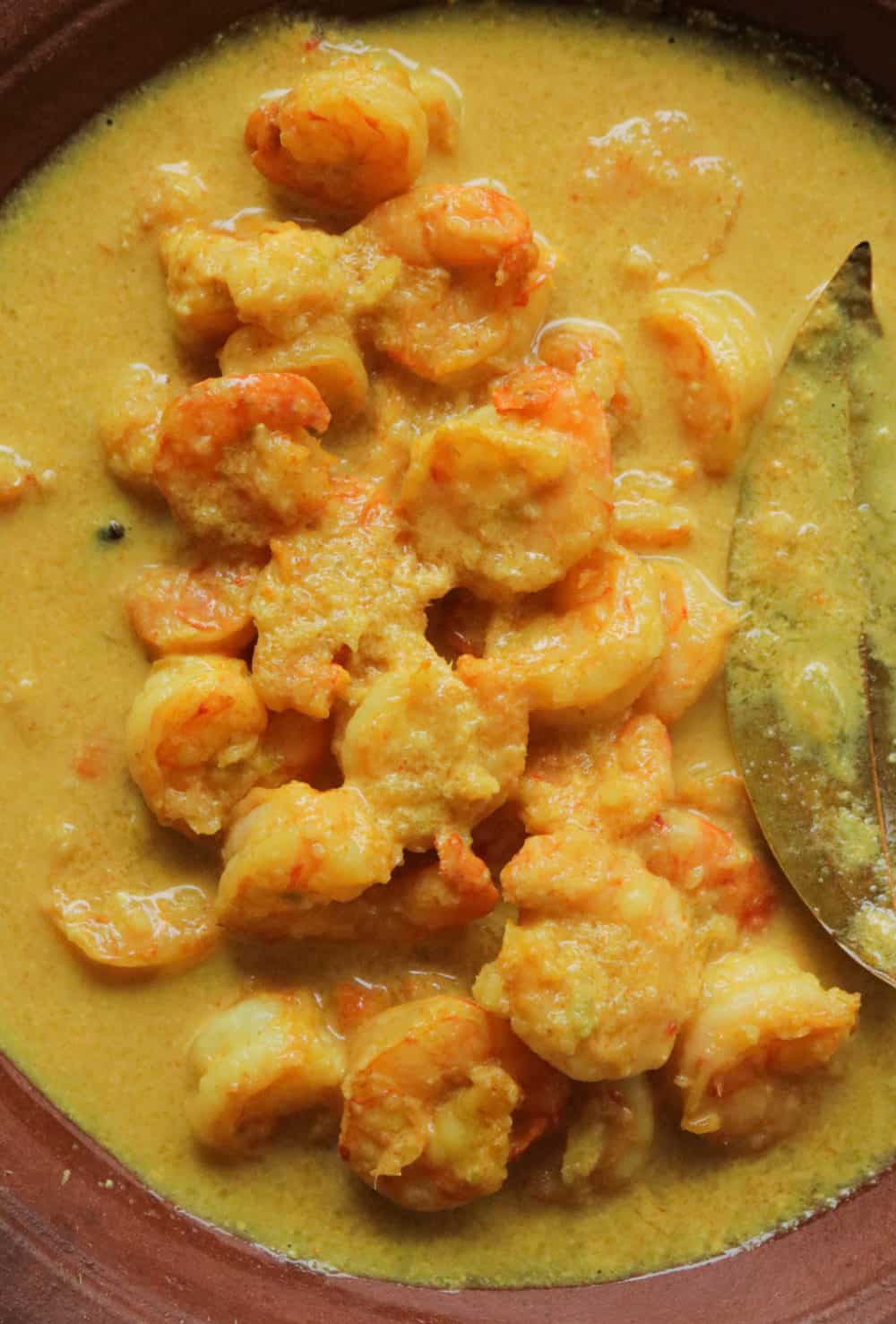 cooked prawn malai curry in a dish.