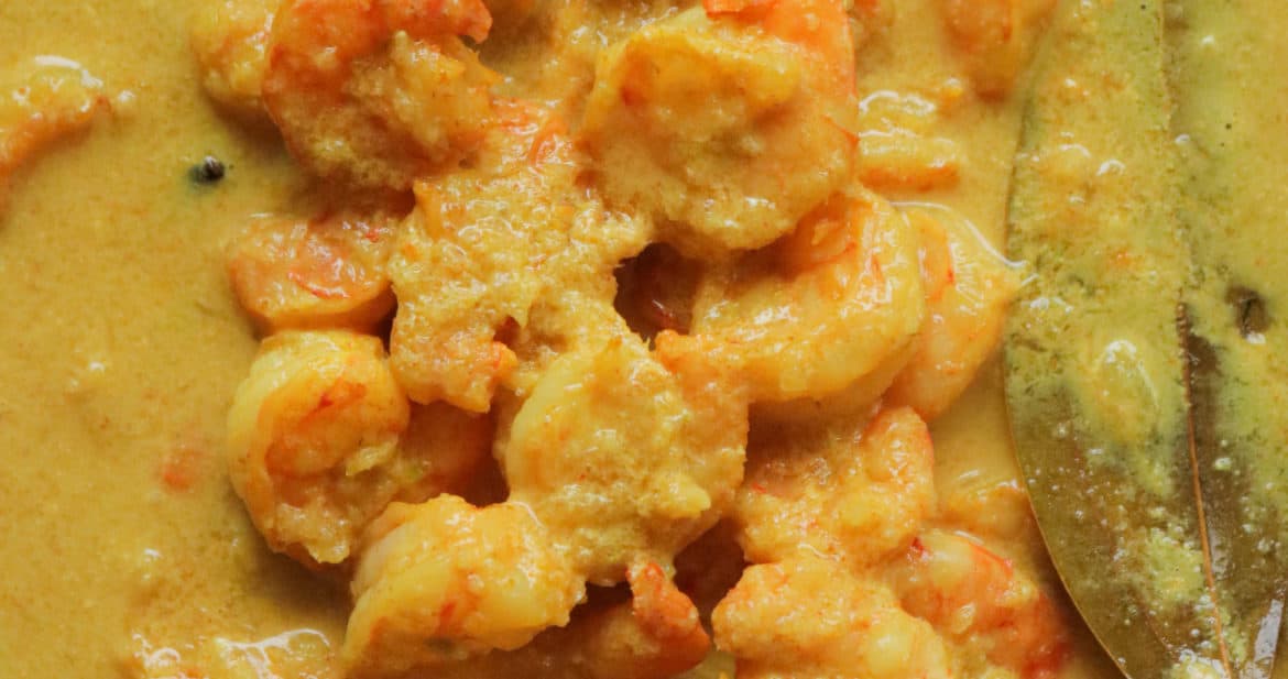 cooked prawn malai curry in a dish.