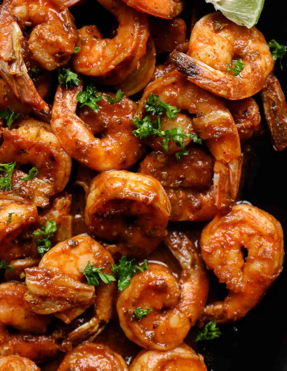 blackened shrimp garnished with lime wedges