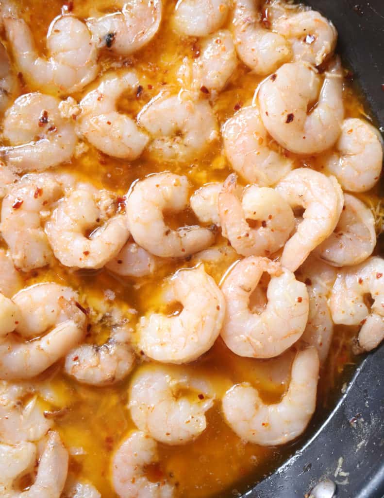 making the lemon shrimp sauce to toss with the pasta.