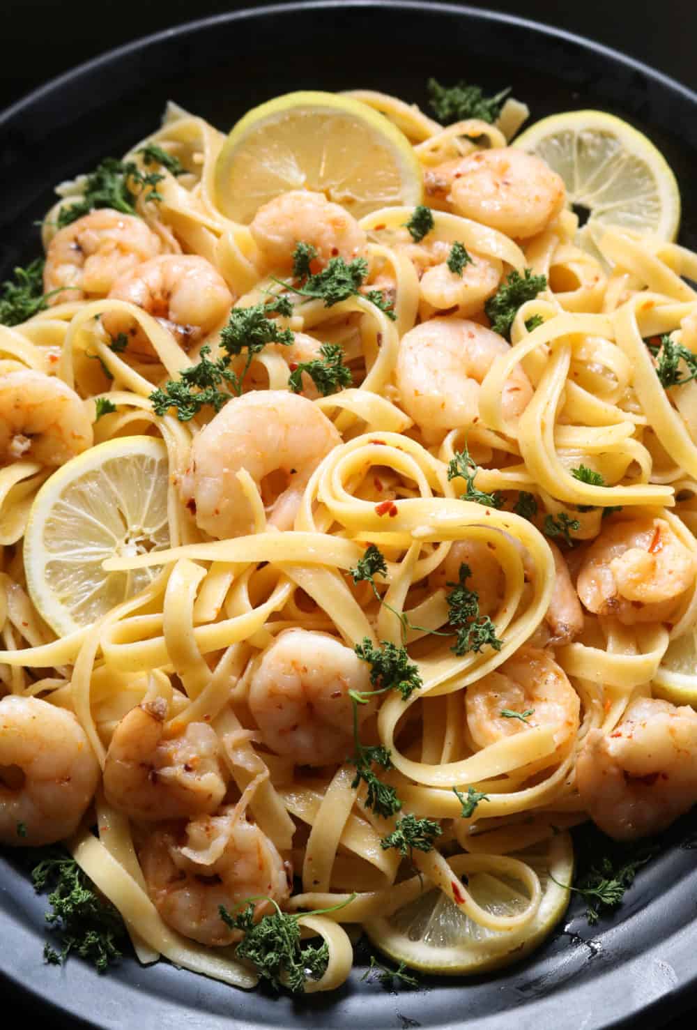 garlic lemon shrimp pasta served on a plate.