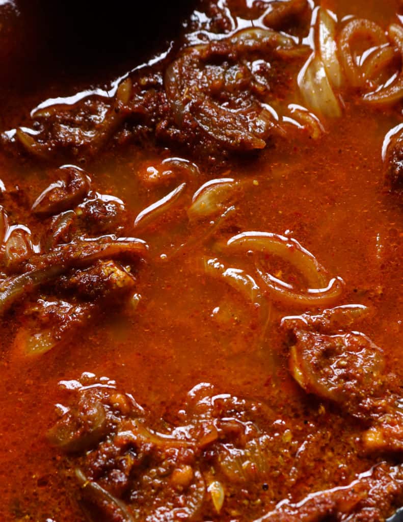 water added to the vindaloo paste to cook the fish curry.